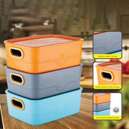 Set of three Wukusy plastic storage baskets with handles, perfect for organizing in home and kitchen spaces.