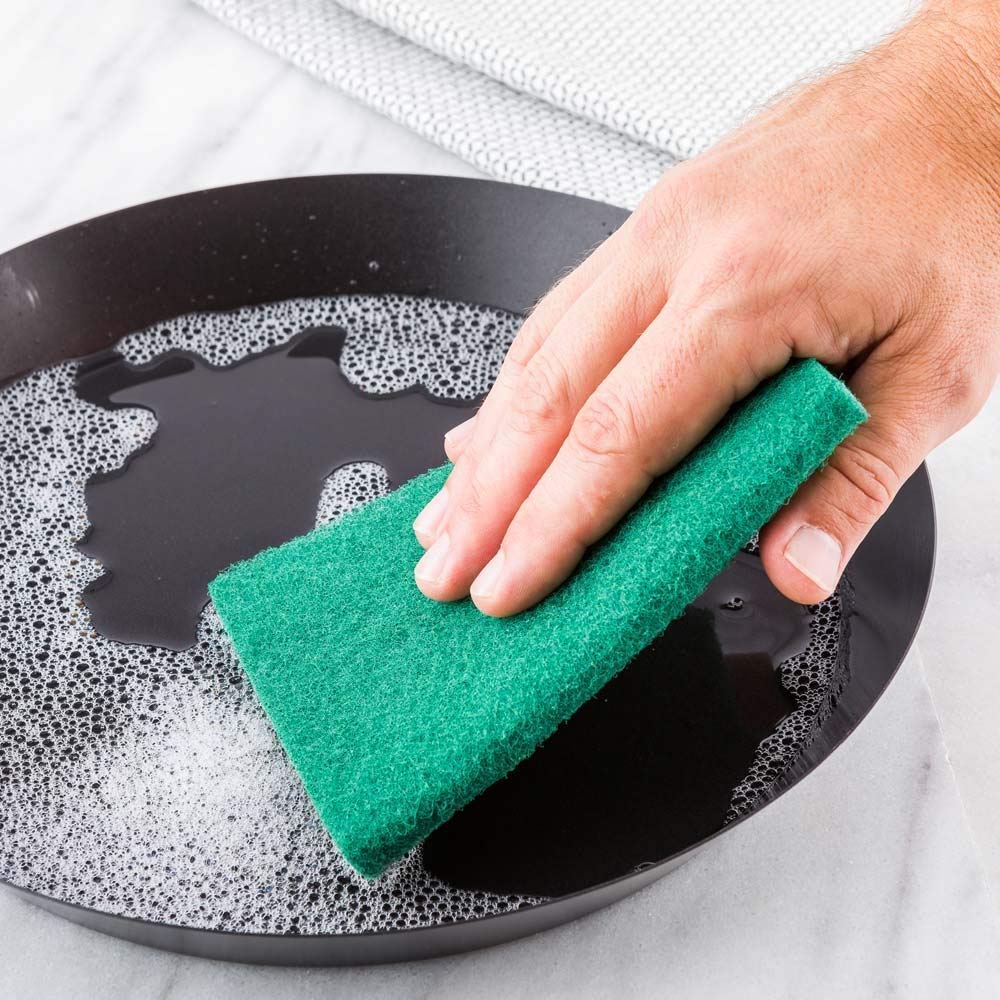 Aqua green Wukusy scrub sponge cleaning pads for kitchen and home use, showing textured surface for scrubbing and cleaning.