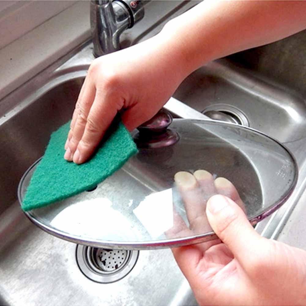 Aqua green Wukusy scrub sponge cleaning pads for kitchen and home cleaning, showing textured surface for scrubbing tasks.