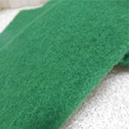 Aqua green Wukusy scrub sponge cleaning pad for kitchen and household cleaning, showing textured surface for scrubbing tasks.