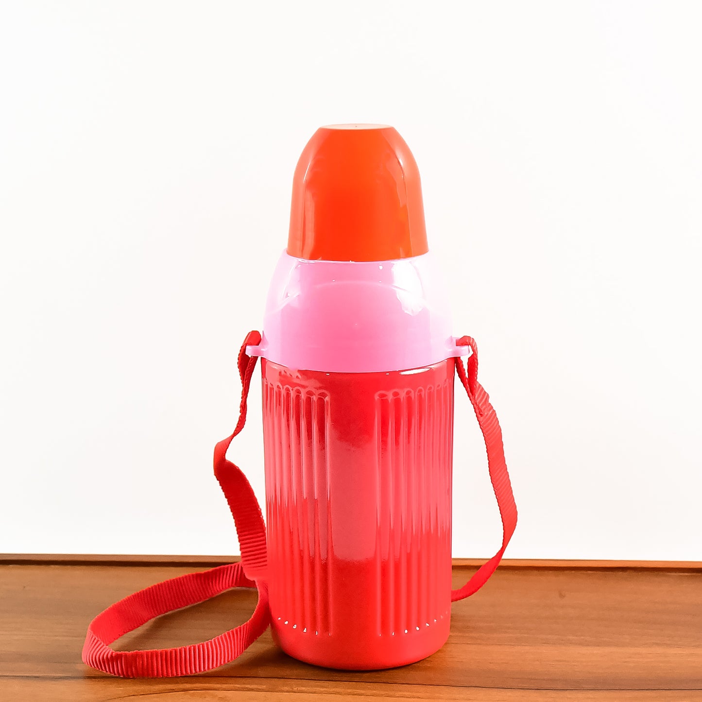 Wukusy 500ml kids insulated plastic water bottle with colorful design, suitable for school and outdoor activities.
