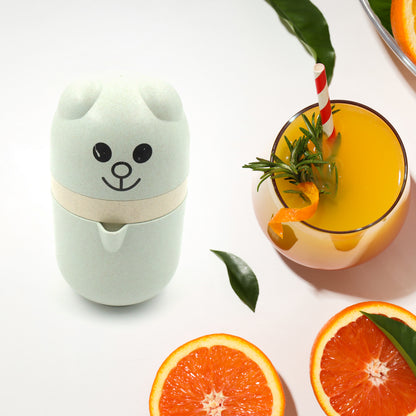 Wukusy manual citrus juicer in food-grade plastic, small portable lime juicer cup for home and travel use.