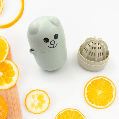 Wukusy small portable manual citrus juicer for limes, food-grade plastic, ideal for home or travel use.