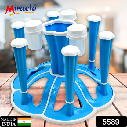 Wukusy plastic glass stand holding six tumblers with pepper and salt shakers on a kitchen dining table.