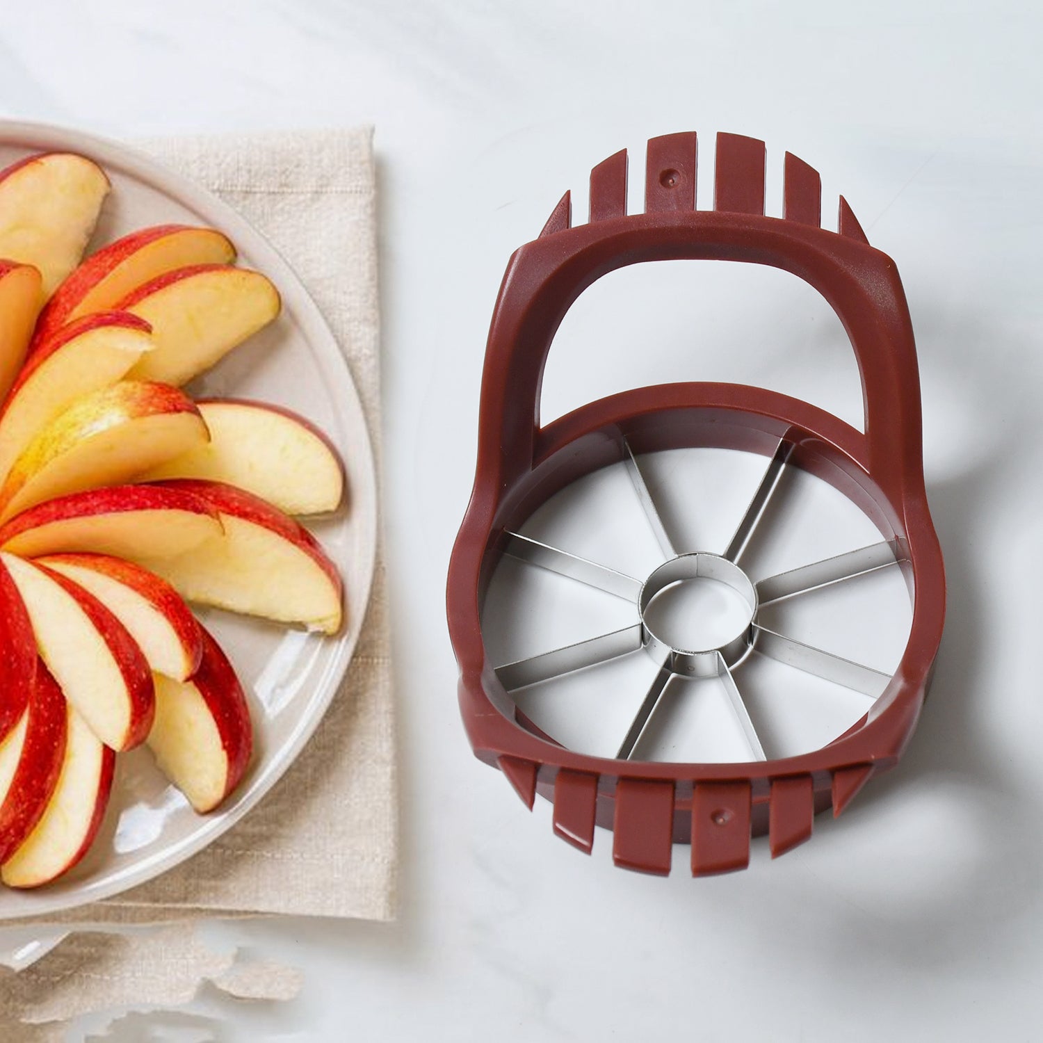 Wukusy stainless steel apple slicer and fruit divider with core remover, kitchen tool for cutting and separating apples.