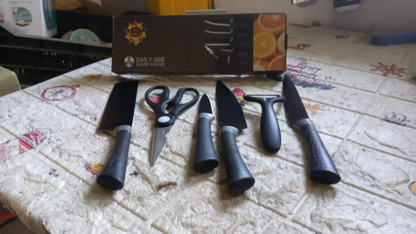 Wukusy 6-piece professional kitchen knife set with non-slip handles, including meat, chef, peeler, and scissors in stainless steel.