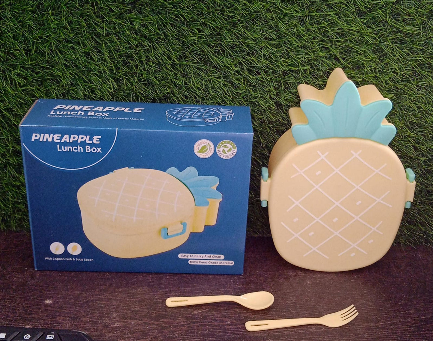 Wukusy kids lunch box shaped like a pineapple with fork and spoon, microwave-safe, portable bento box for snacks and meals.