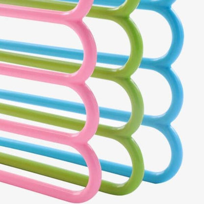 Wukusy 5-in-1 multipurpose plastic hanger with five layers, assorted colors, ideal for organizing clothes in home and kitchen spaces.