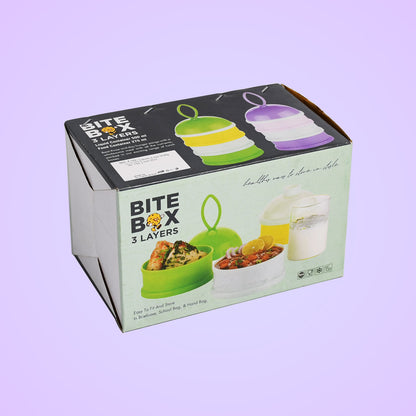 Green Wukusy 3-layer lunch box with liquid food container, featuring a unique design for storing and transporting meals.