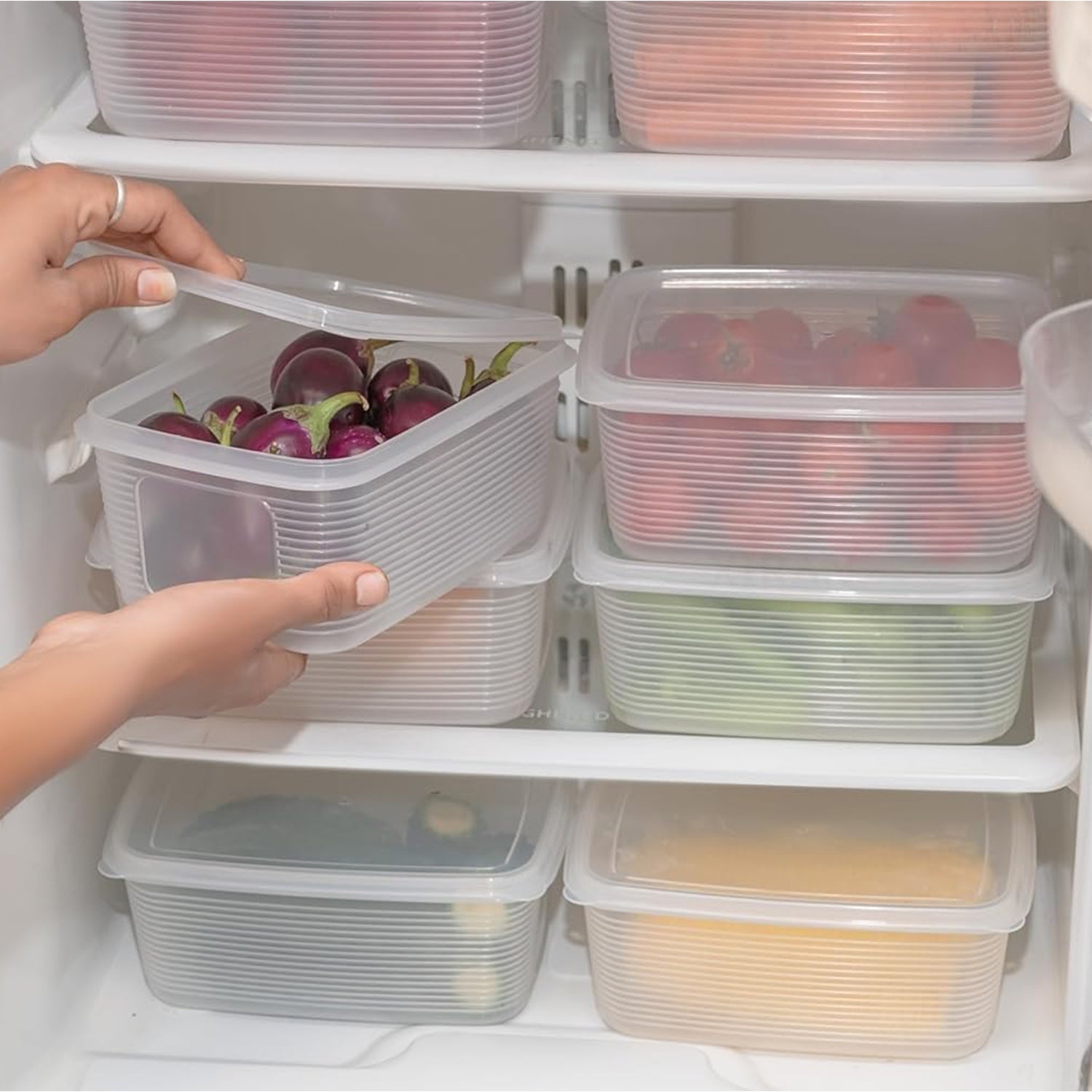 Six Wukusy plastic food storage containers in various sizes for kitchen organization and food preservation.