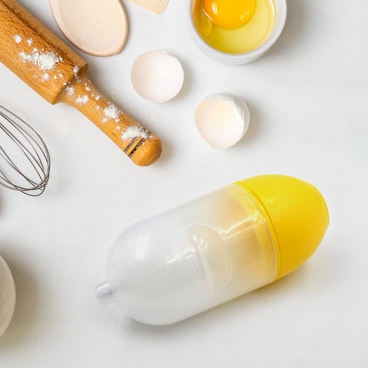 Wukusy manual egg puller and scrambler in white, kitchen tool for mixing egg yolks without breaking eggs, household use.