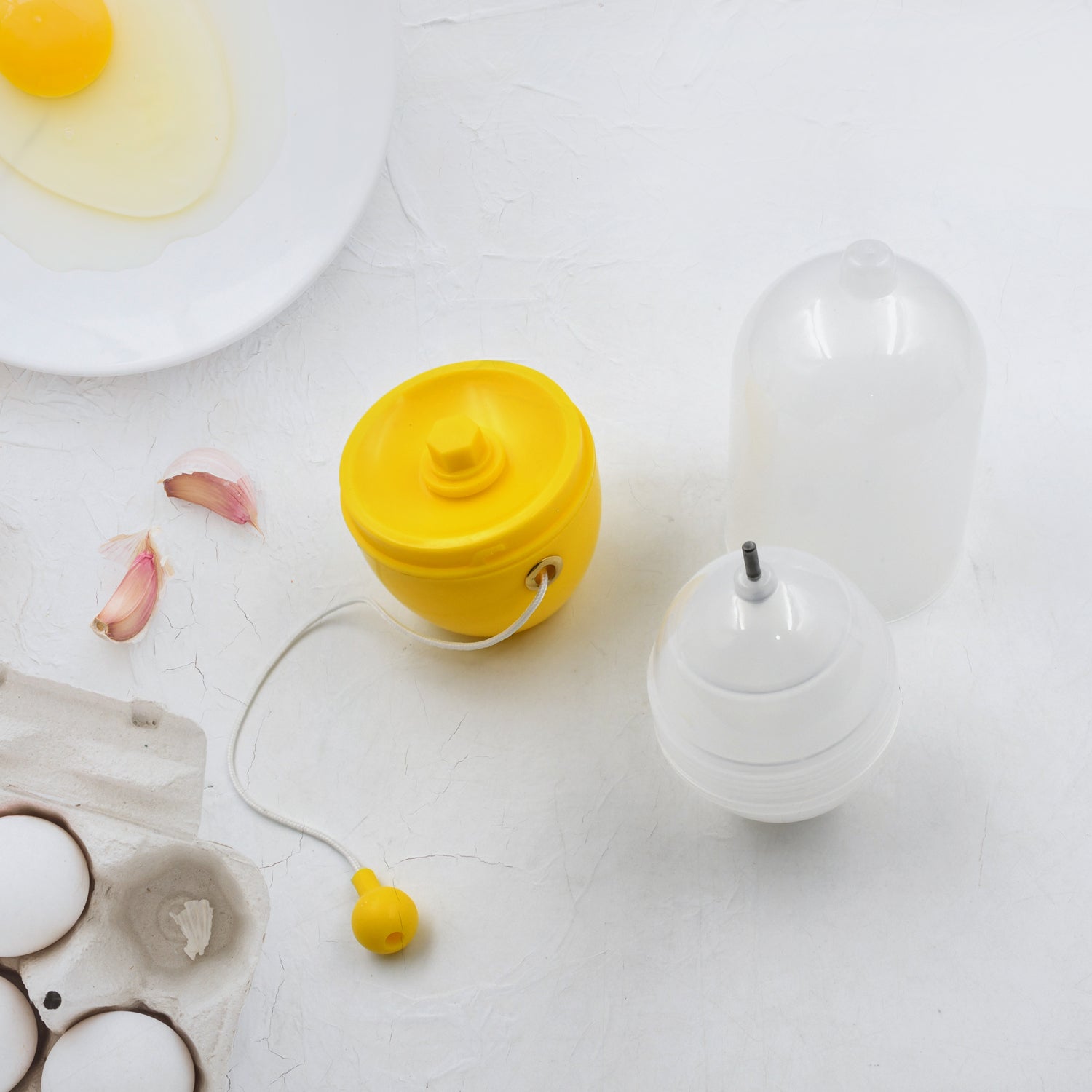 Wukusy manual egg puller and scrambler in white, kitchen tool for mixing egg yolks without breaking eggs, household use.