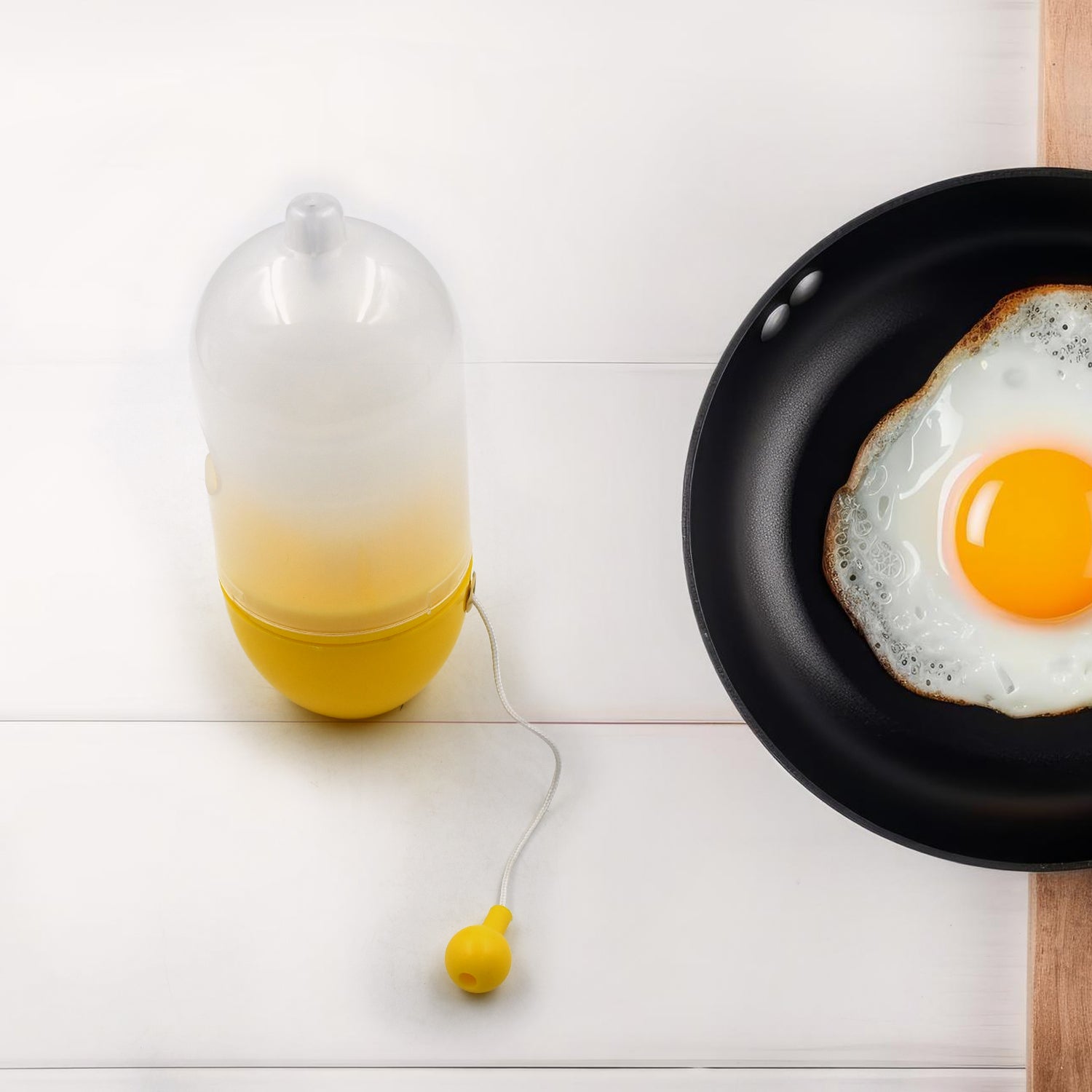 Wukusy white manual egg puller and yolk mixer, household kitchen tool for scrambling eggs without breaking them.
