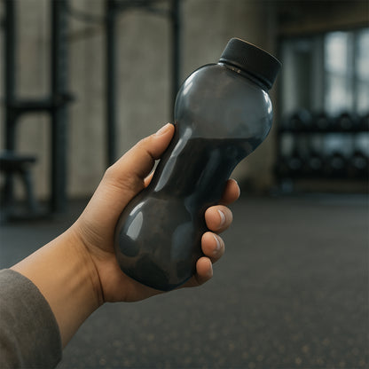 Wukusy 550ml dumbbell-shaped gym water bottle for home and fitness use, with a durable plastic design and screw-top lid.