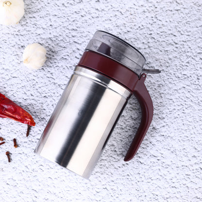Wukusy stainless steel oil dispenser with small nozzle, 500ml capacity, for kitchen use, featuring a sleek, modern design.