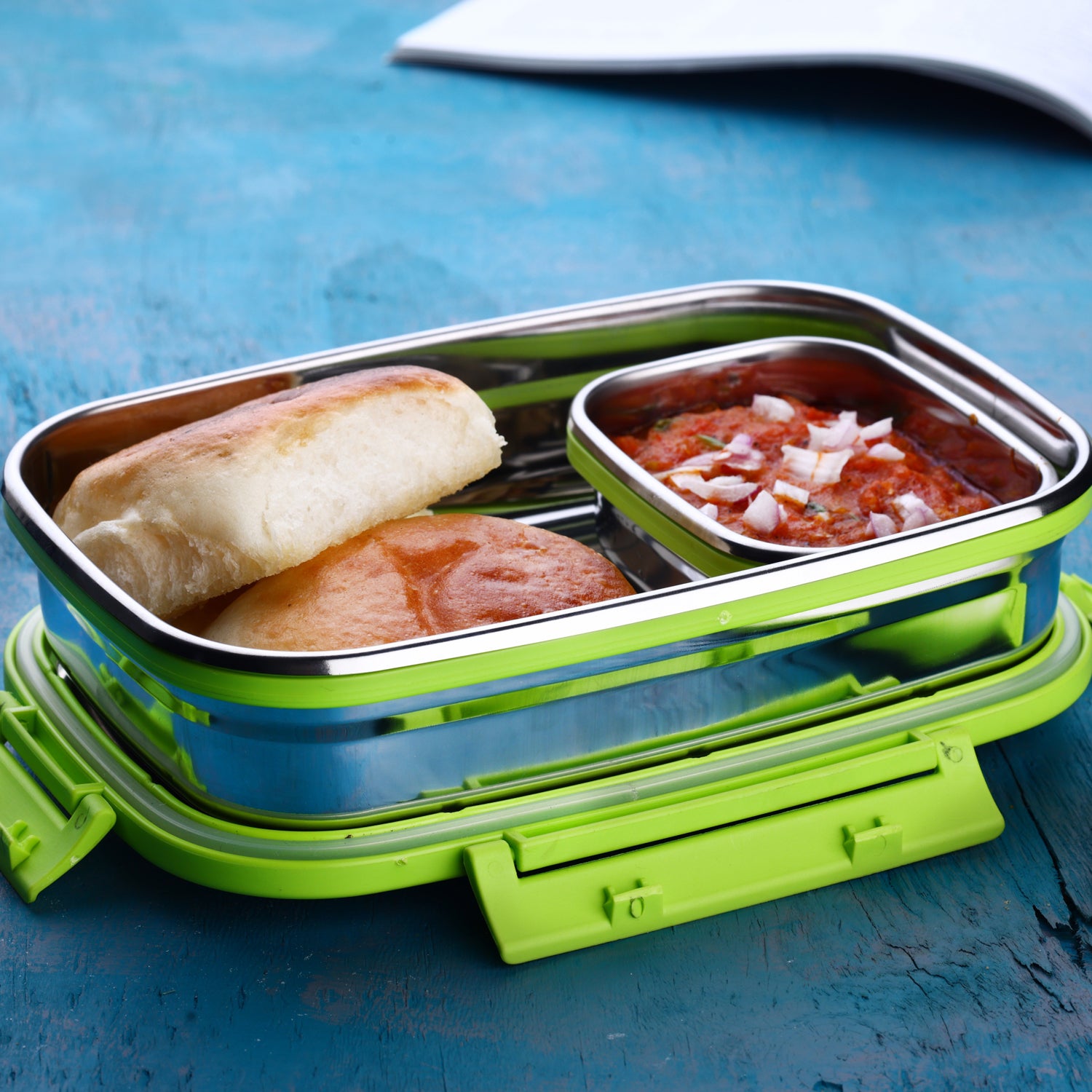 Stainless steel lunch pack for office and school by Wukusy, featuring a durable container with compartments for meals.