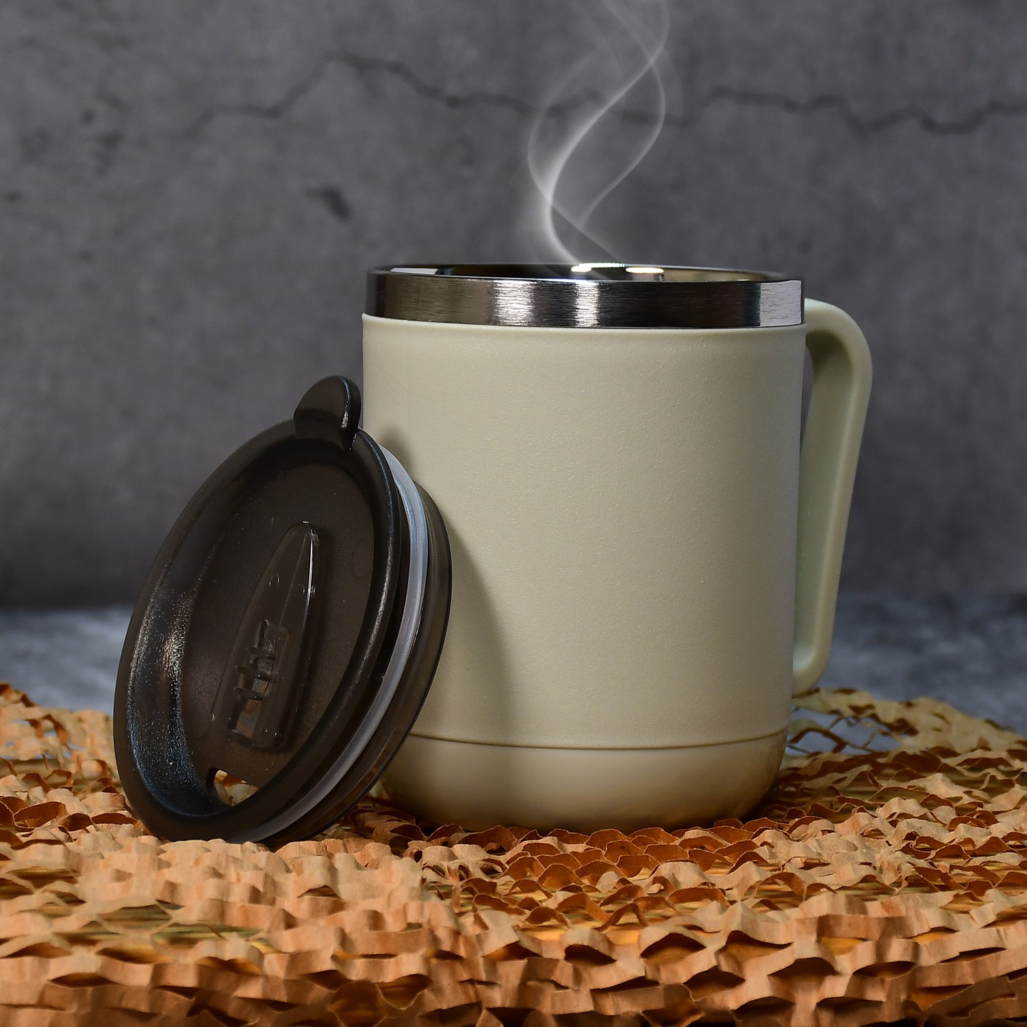 Wukusy Ganesh premium stainless steel coffee mug with heat-resistant lid, 400ml capacity, ideal for home and kitchen use.