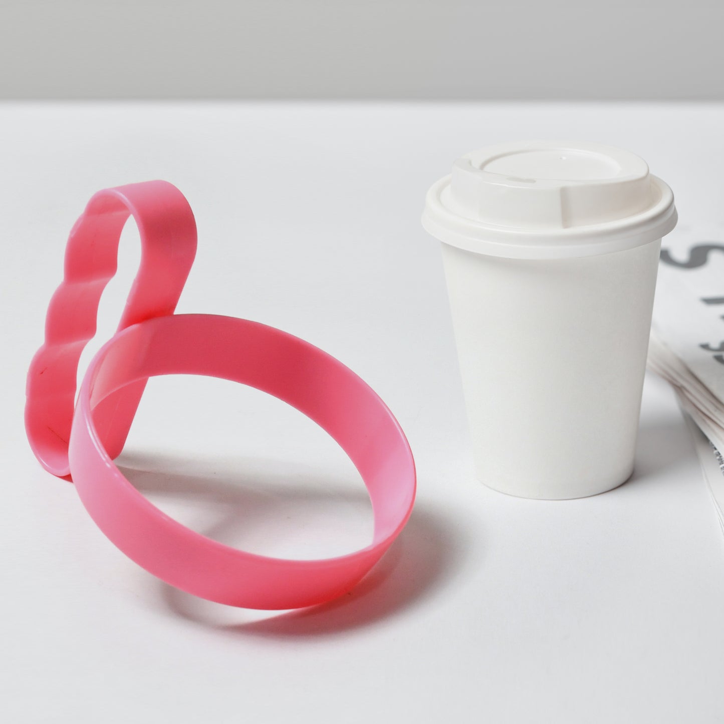 Wukusy plastic tumbler handle with anti-slip grip, lightweight cup holder for travel mugs, designed for secure, comfortable use.