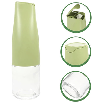 Wukusy 500ml glass oil dispenser with automatic open lid for cooking, grilling, and frying in a kitchen setting.