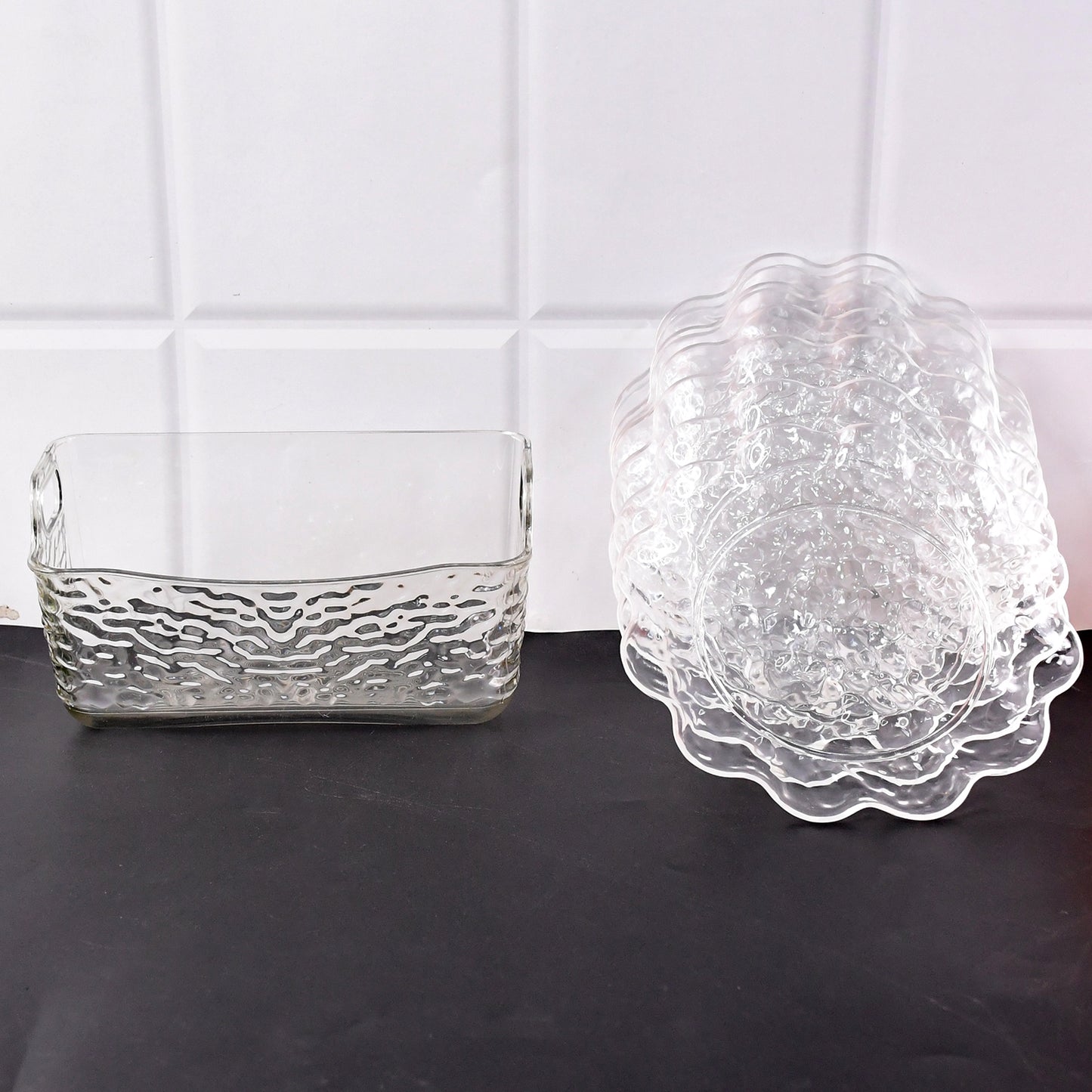 Wukusy 9-in-1 plastic bowl set with serving tray and plates, perfect for home kitchen use. Clear view of bowls and tray layout.