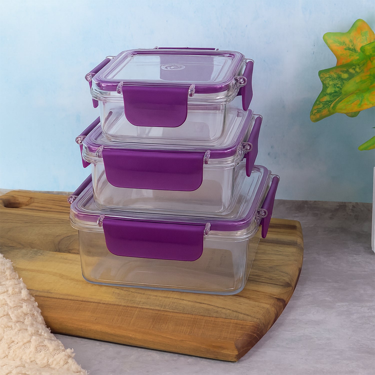 Wukusy airtight square food storage container set with three clear, stackable containers for kitchen organization and freshness.