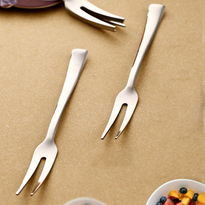 Wukusy Apex 6-in-1 stainless steel fruit fork set with multiple tips for versatile fruit preparation and serving.