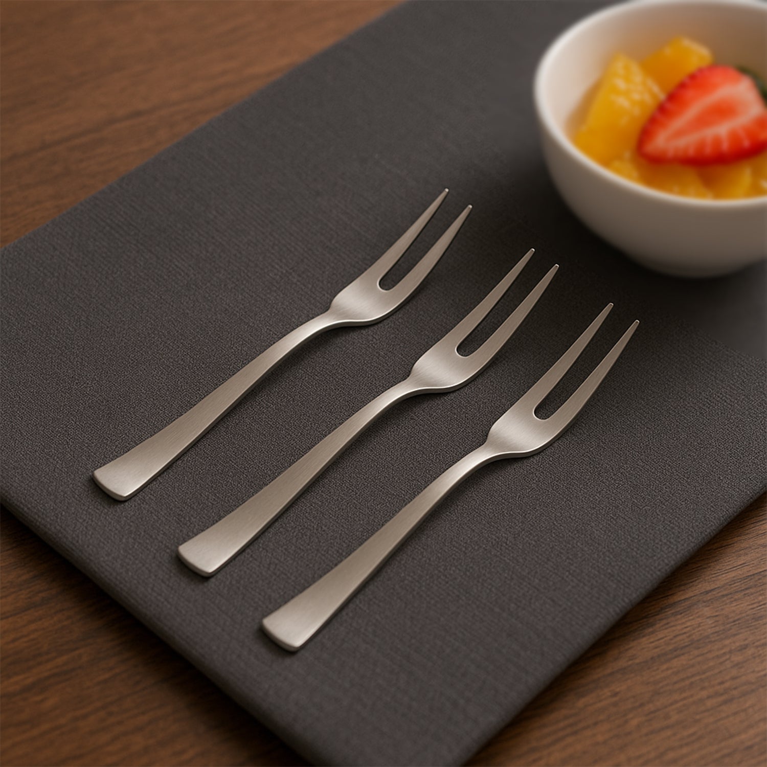 Wukusy Apex 6-in-1 stainless steel fruit fork set with six different fork types for versatile fruit serving in home and kitchen.