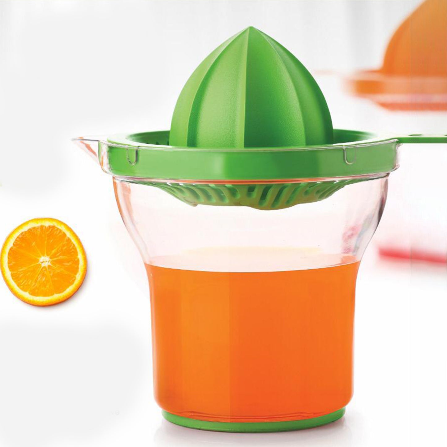 Wukusy Apex manual citrus juicer on kitchen countertop, showing stainless steel reamer and plastic juicing bowl.