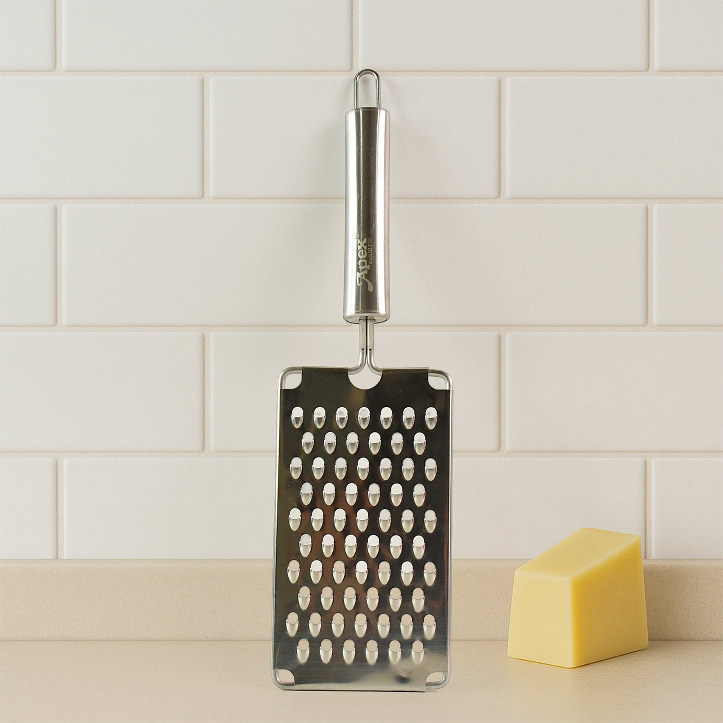 Wukusy Apex Premium stainless steel vegetable grater for kitchen, with multiple grating surfaces for cheese, vegetables, and more.