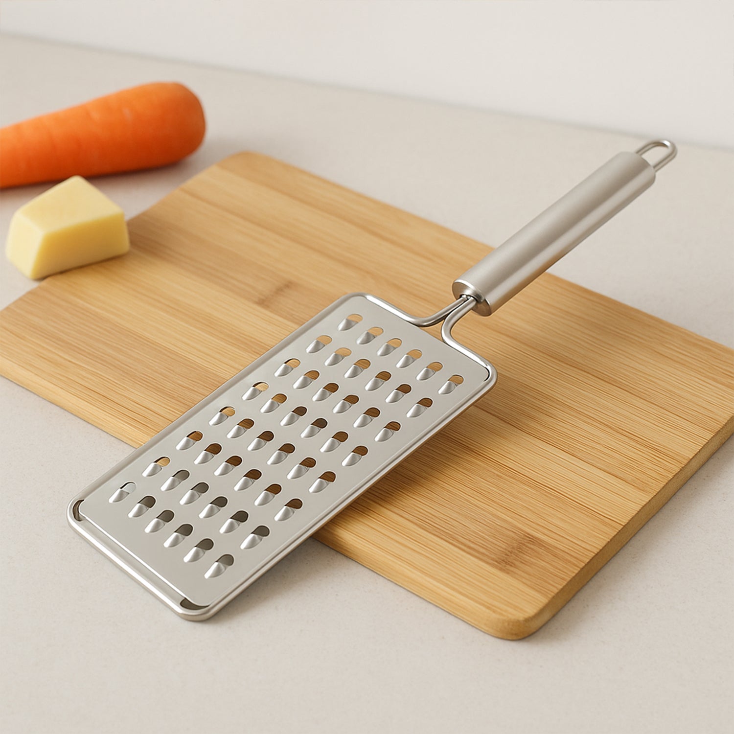 Wukusy Apex Premium stainless steel vegetable grater for kitchen use, featuring multiple grating surfaces and a sturdy handle.