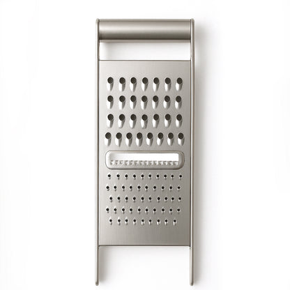 Wukusy Apex 3-in-1 stainless steel grater and slicer for versatile food prep in the kitchen.