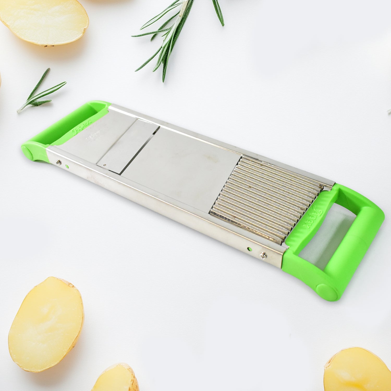 Wukusy Apex stainless steel 2-in-1 vegetable slicer showing multiple blades for slicing and julienning in a home kitchen setting