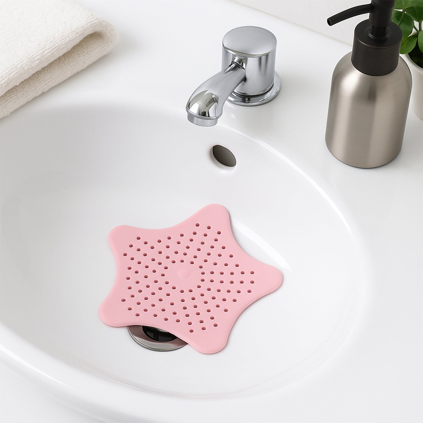 Baby pink silicone star-shaped sink filter by Wukusy, bathroom hair catcher and drain strainer for basin.