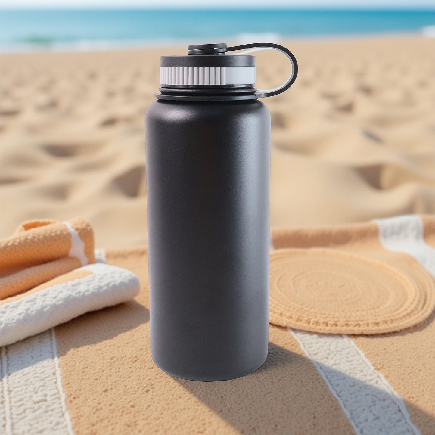Black stainless steel Wukusy 1000ml double wall vacuum-insulated water bottle for hot and cold drinks.