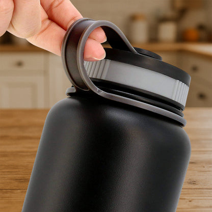 Black stainless steel Wukusy 1000ml double wall vacuum-insulated water bottle for hot and cold drinks.