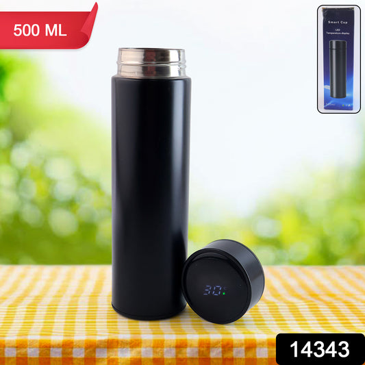 Black Wukusy vacuum insulated water bottle, 500ml stainless steel bottle for hot and cold beverages in a home and kitchen setting.