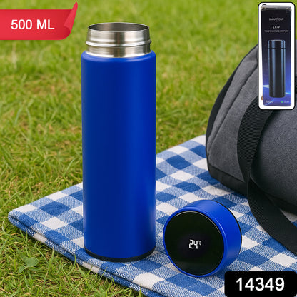 Blue vacuum insulated water bottle by Wukusy, 500ml for home and kitchen, keeps drinks hot or cold.