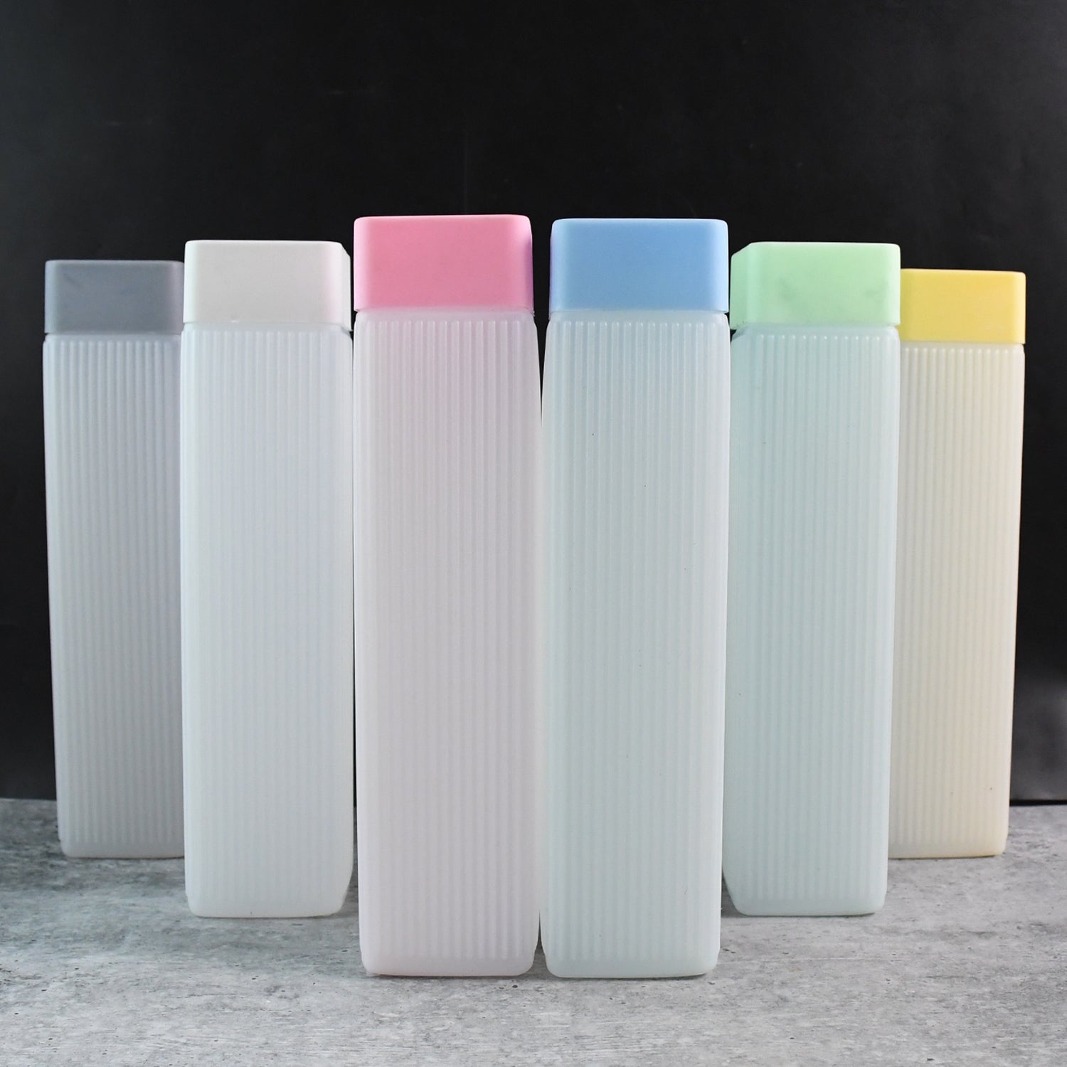 Six Wukusy BPA plastic leakproof hydration water bottles in various sizes for home and kitchen use.