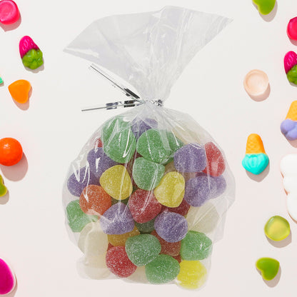 Set of 25 clear cookie and treat bags from Wukusy, flat and transparent for packaging baked goods and gifts.