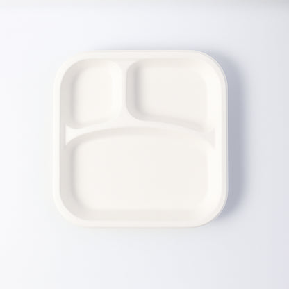 Wukusy compostable bagasse 3-compartment square meal plate for home and kitchen use, showing divided sections for food.