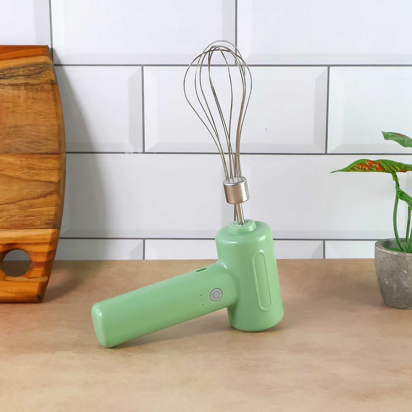Wukusy cordless electric whisk and egg beater in white, handheld kitchen tool for mixing eggs and batter.