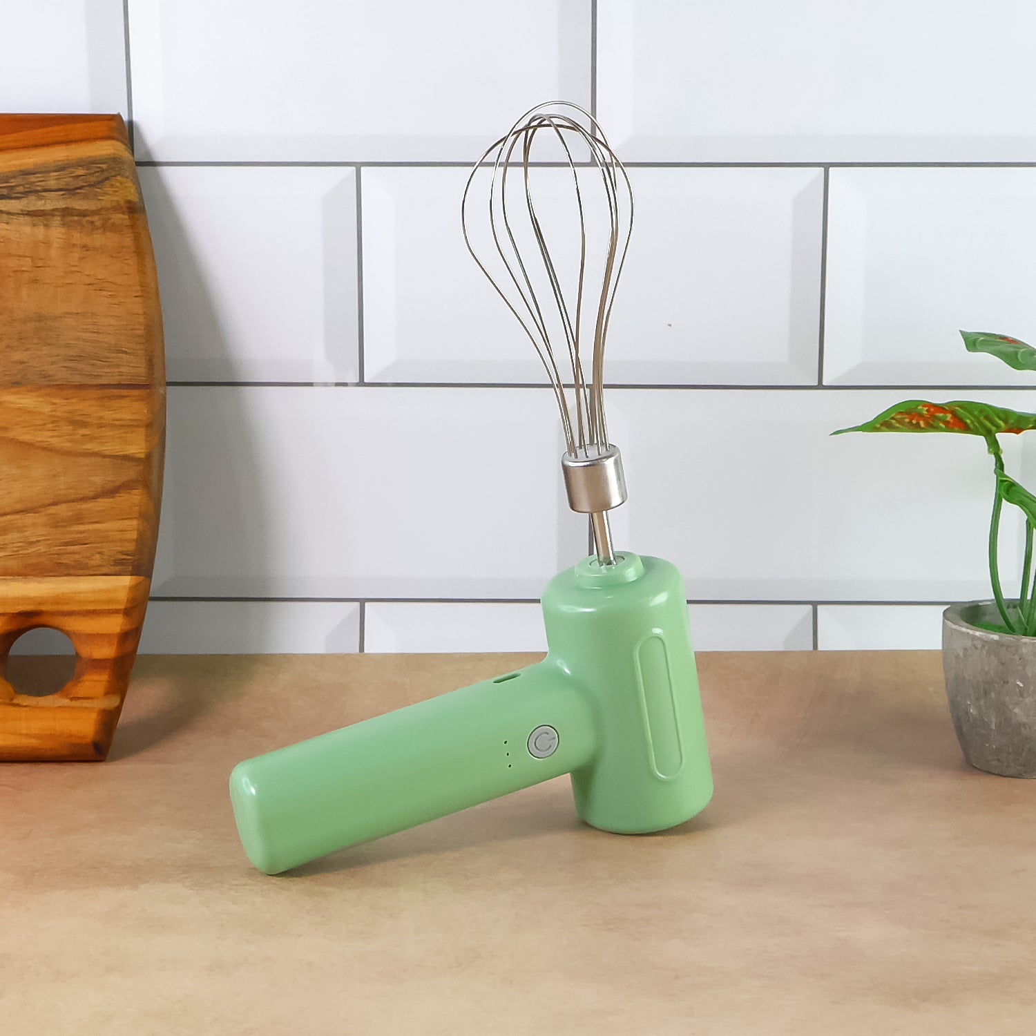Wukusy cordless electric whisk and egg beater in white, handheld kitchen tool for mixing eggs and batter.