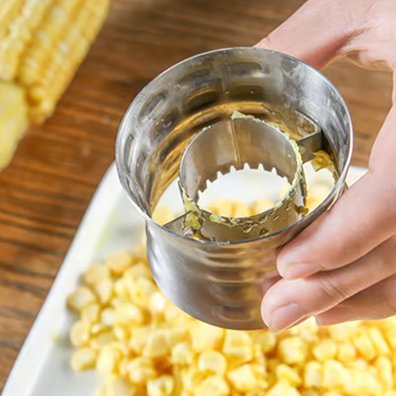 Stainless steel corn cutter and kernel remover by Wukusy, designed for easy stripping and processing fresh corn in the kitchen.