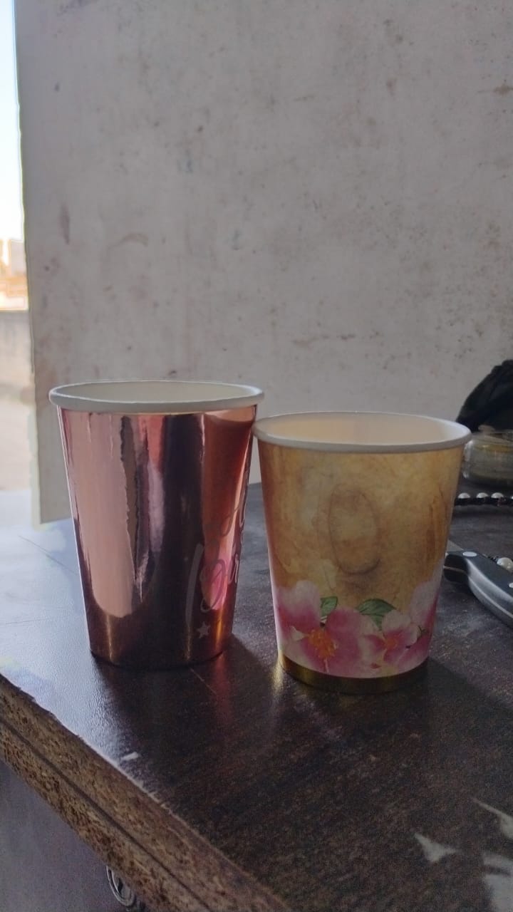 Set of 24 Wukusy disposable paper cups in mixed colors and designs, ideal for tea and coffee at home or gatherings.