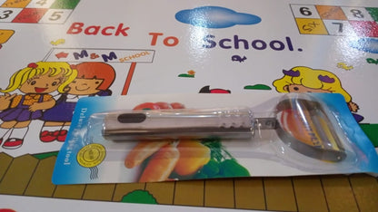 Wukusy fruit and vegetable peeler tool for easy peel removal, shown with peeled fruit and vegetables on a kitchen countertop.