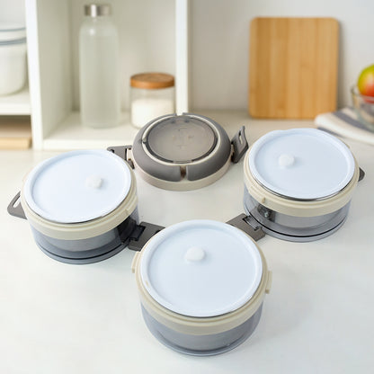 Wukusy Ganesh Steko-3 triple-layer stainless steel insulated lunch box set, with multiple compartments for food storage.