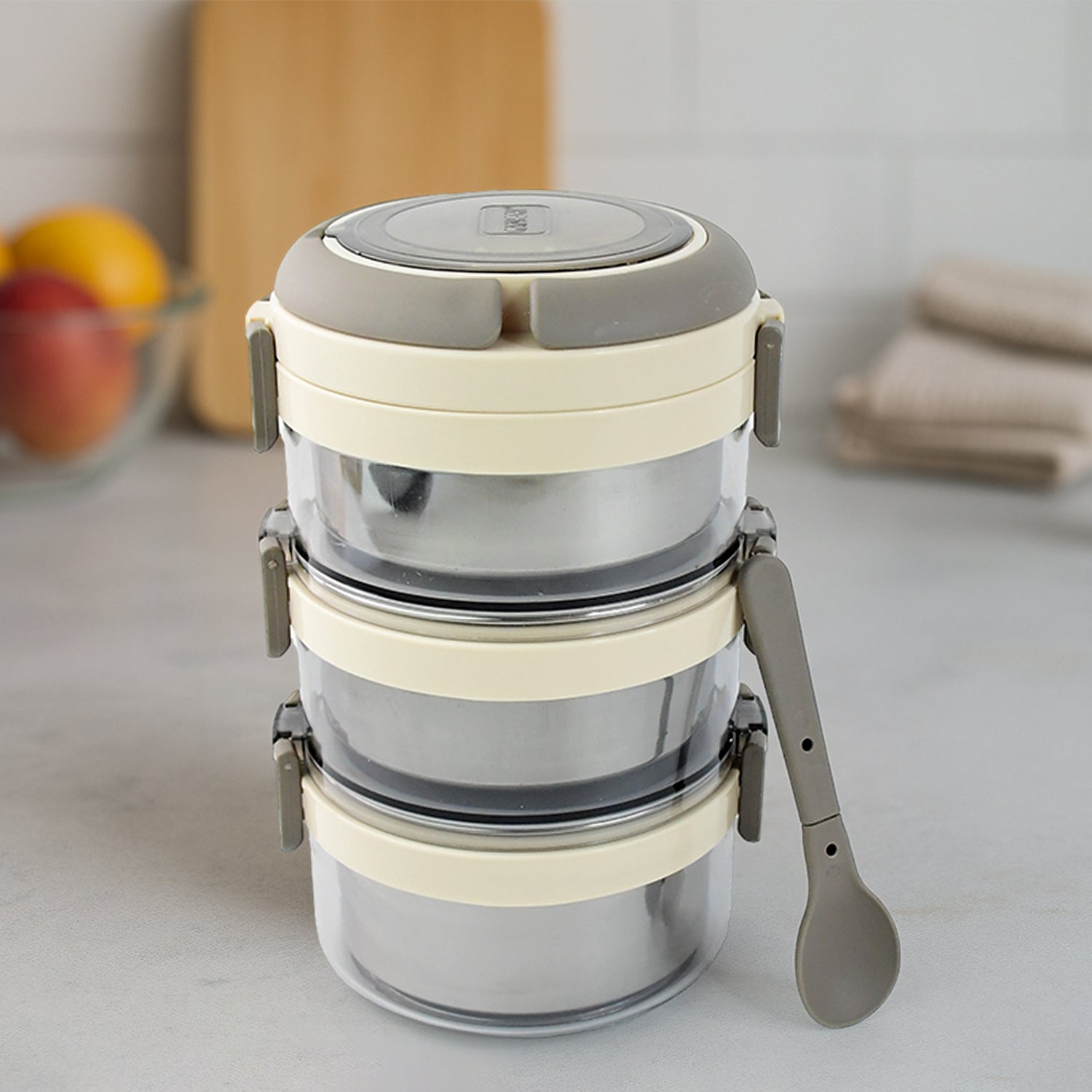 Wukusy Ganesh Steko-3 stainless steel insulated lunch box set with three layered compartments for home and kitchen use.