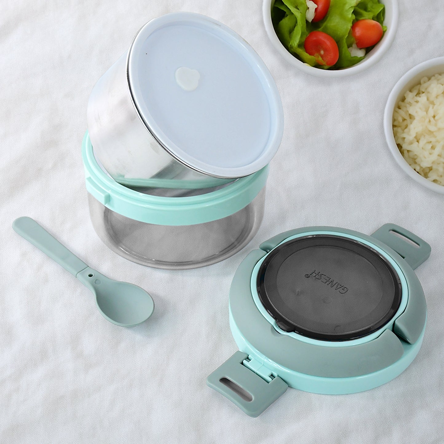 Wukusy Ganesh Tiara 400ml stainless steel insulated lunch box with leakproof lid and folding spoon for home and kitchen use.