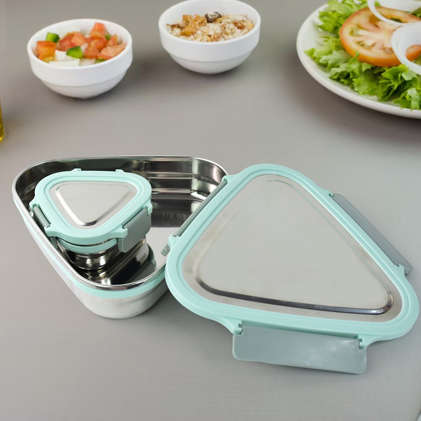 Wukusy Ganesh Trinity 2-piece stainless steel triangle lunch box set for home and kitchen storage.