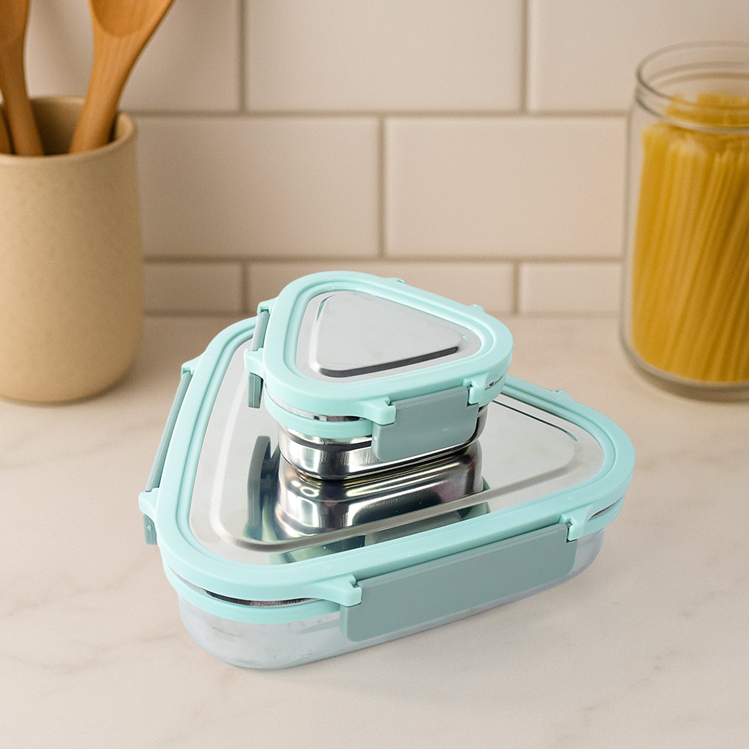 Wukusy Ganesh Trinity 2-piece stainless steel triangle lunch box set for home and kitchen storage.
